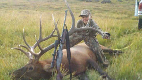 Matt and his elk with rifle.jpg