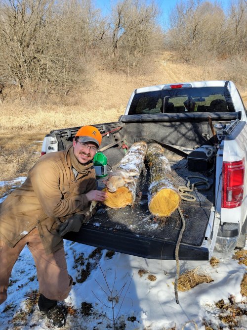 20220226 David Delaney with rabbit and 2 chunks of Osage Orange for long bows.jpg 20220226 David Delaney with rabbit and 2 chunks of Osage Orange for long bows.jpg