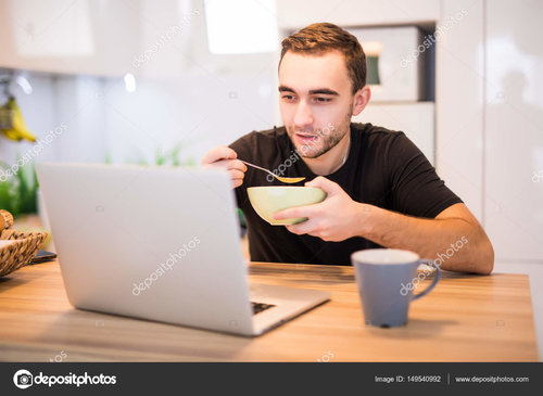 depositphotos_149540992-stock-photo-man-eating-breakfast-using-laptop.jpg