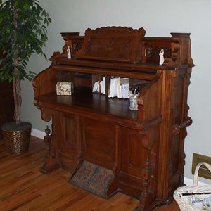 Old antique pump organ case given to me by my FIL. Worked it over for 6 month and turned it into a desk