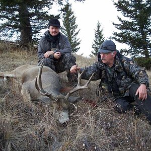 My friend Ralph and outfitter Frank Simpson, with the buck Ralph shot in the afternoon of our last day hunting in the foothills of the Rocky Mountain 