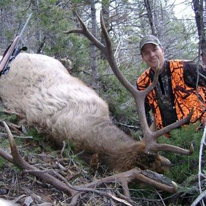 Son, Tyler with his 6-point bull taken in November, 2010.