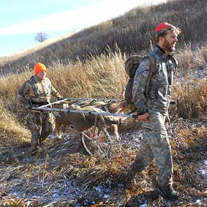 Brother and sister in law carting out their extra doe's they harvested.