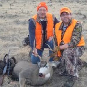 Me and my step-dad with my mule deer buck