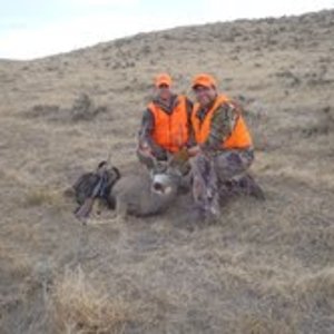 Me and my brother-in-law with my mule deer buck