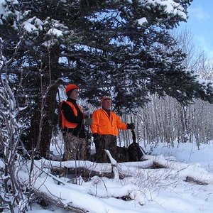 Friend and my dad where we sit on a little aspen bench.