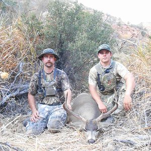 My hunting partners buck we harvested on a backpack hunt in a local wilderness area. He is on the left and I am on the right.