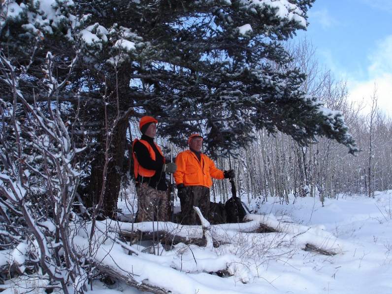 Friend and my dad where we sit on a little aspen bench.