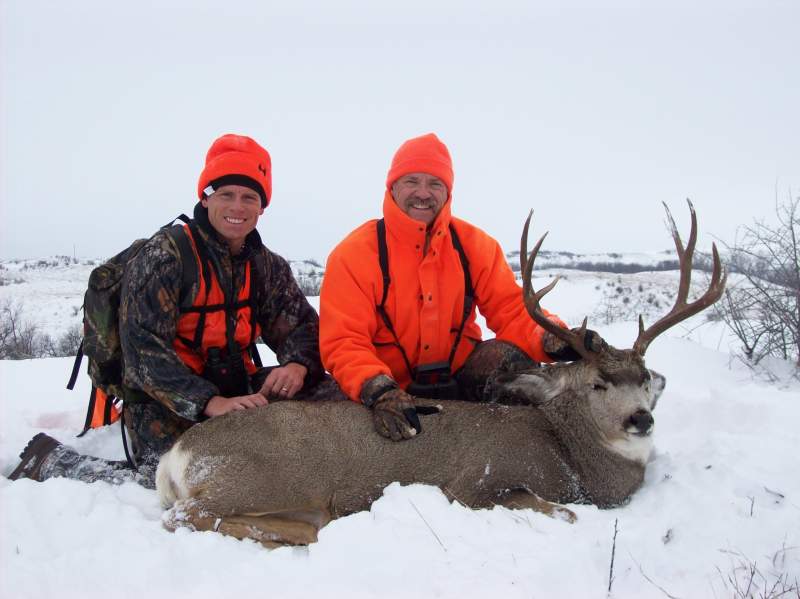 Me and my dad with his 2009 ND Mule Deer