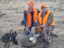 Me and my step-dad with my mule deer buck