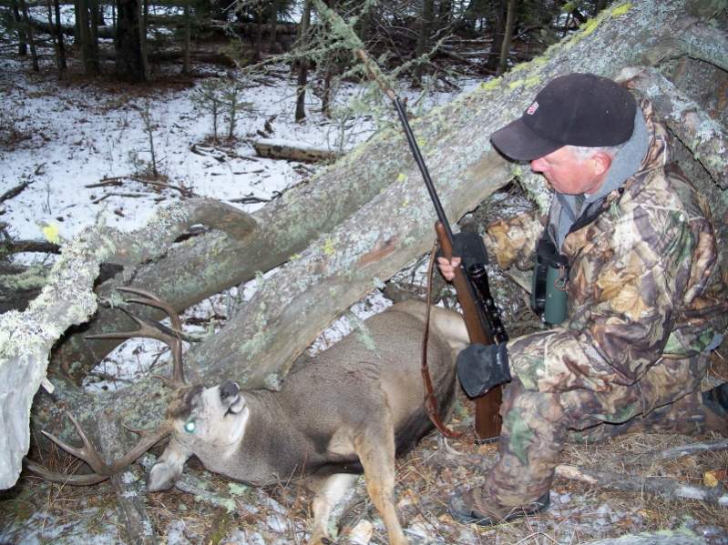 My Alberta mule deer where he fell. Hunting the foothills of the Rocky Mountain front with Frank Simpson in November, 2007.