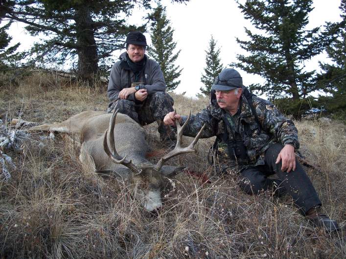 My friend Ralph and outfitter Frank Simpson, with the buck Ralph shot in the afternoon of our last day hunting in the foothills of the Rocky Mountain 