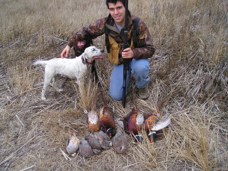 My son John with Olive and our Chocolate Lab Reese who passed away in June at age 14.