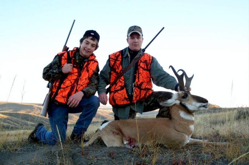 My son, Tyler and Grandson, Dylan with a buck they both shot at in Eastern Montana.  2008.