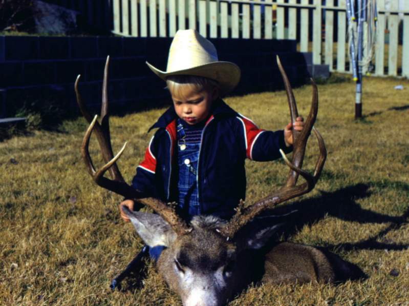 My son, Tyler with a nice buck I took in the Big Belt's in the early 1970's.