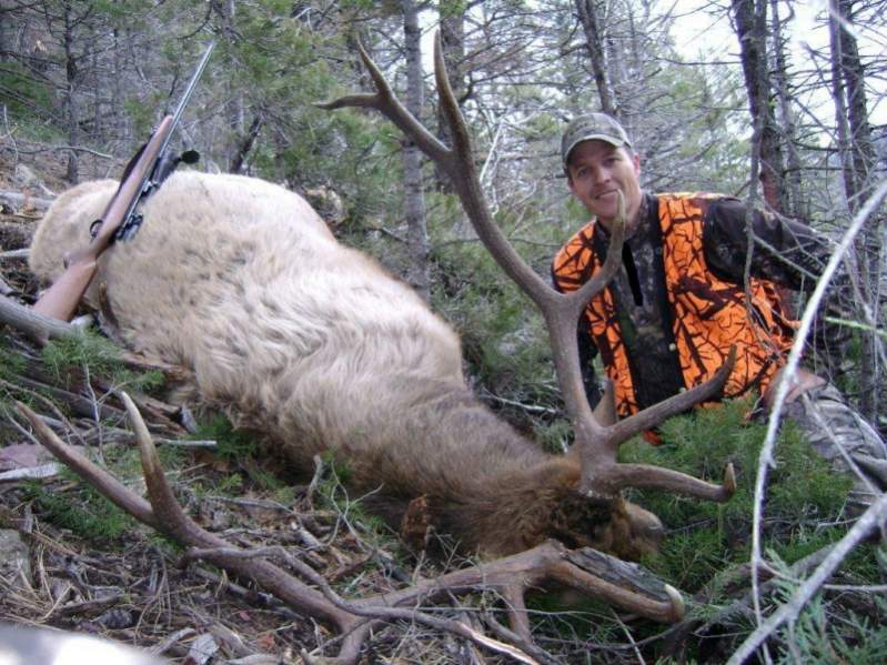 Son, Tyler with his 6-point bull taken in November, 2010.