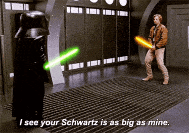 a man holding a lightsaber says  i see your schwartz is as big as mine .. 
